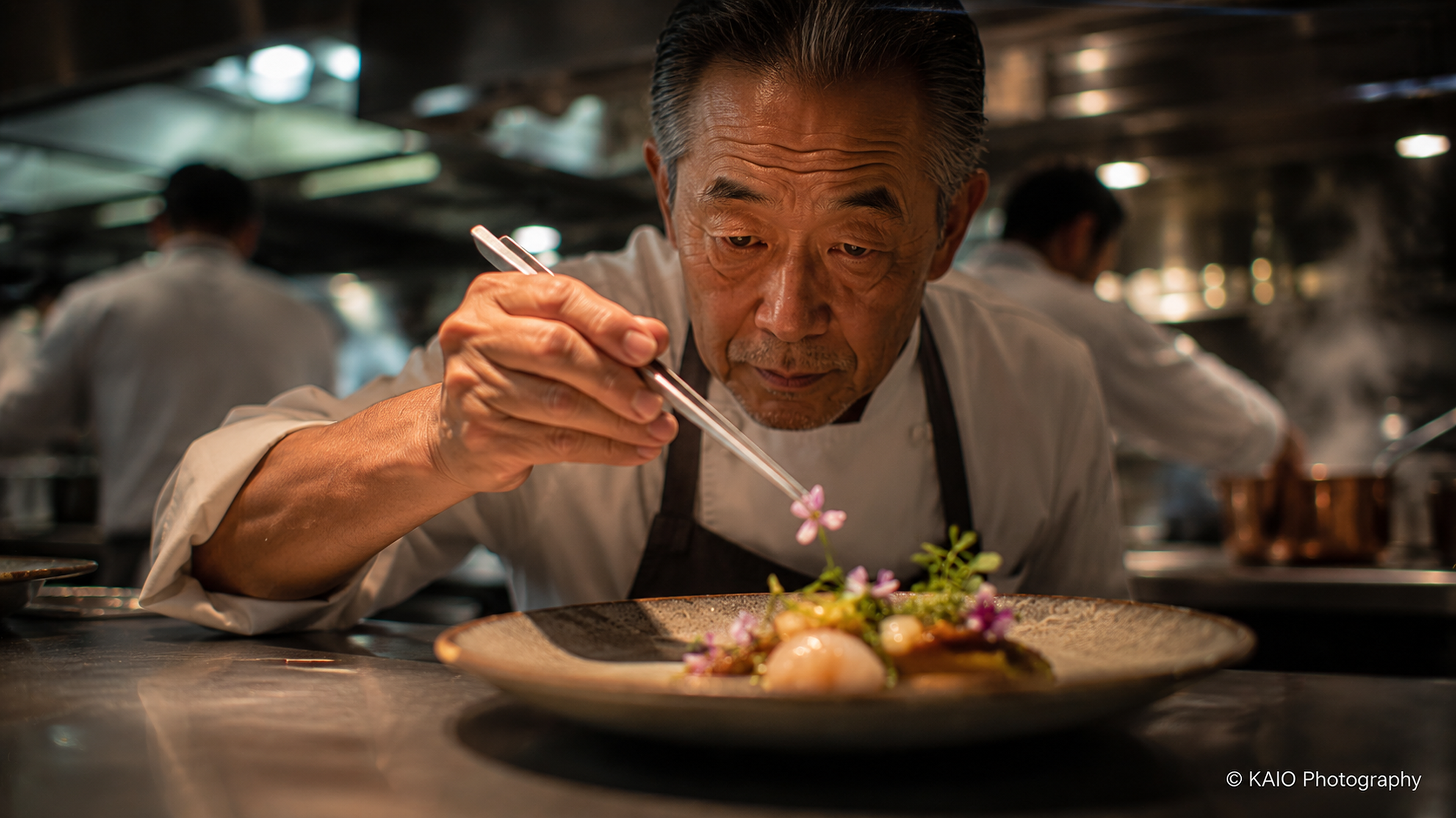 Chef carefully plating a fine dining dish