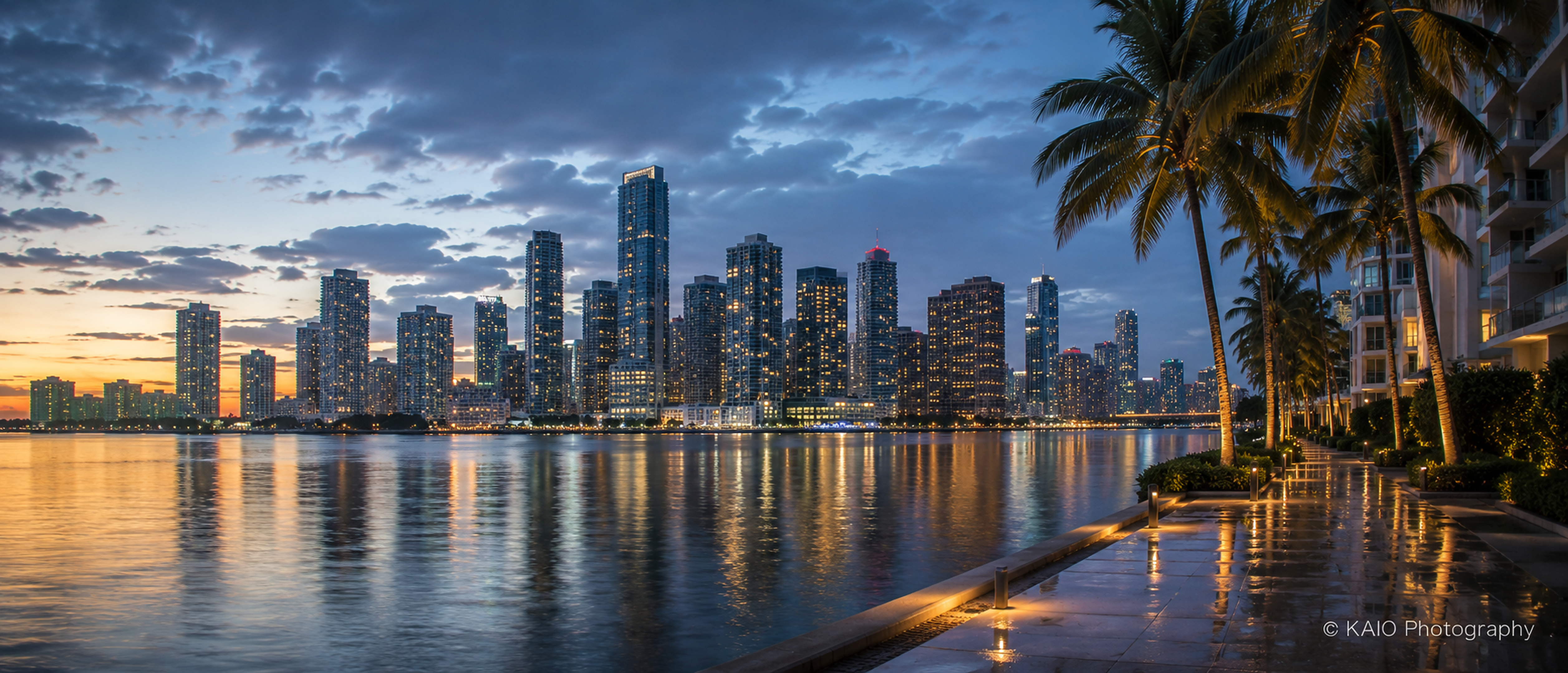 Panoramic waterfront cityscape at blue hour